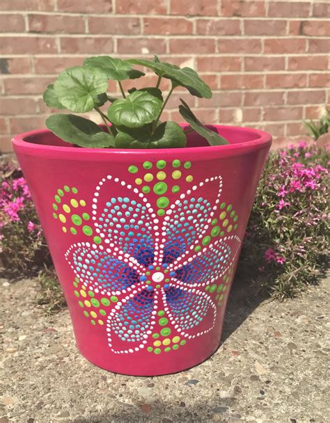 A Potted Plant With Flowers Painted On It