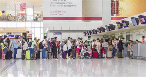 Passengers Queuing Up In Check In Counter In The Hong Kong