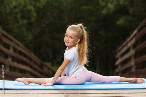 Babe Girl Sitting On The Splits Outdoor Buy This Stock Photo And