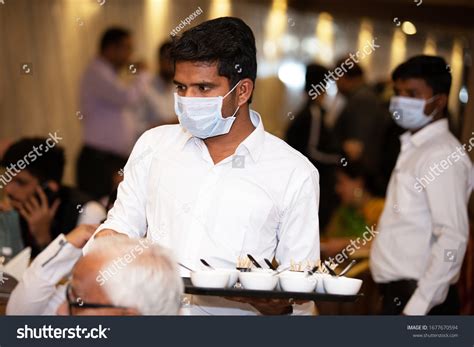Indian Waiter Serving Over 340 Royalty Free Licensable Stock Photos