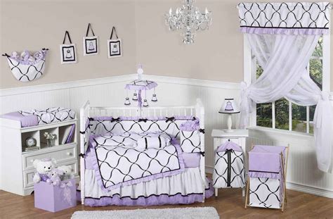 This water color floral 8 piece crib bedding set includes 1 comforter, 2 crib sheets (2 prints), 1 crib skirt, 1 printed pillow, 1 diaper stacker, 1 coral fleece blanket w/ applique, 1 changing pad cover. Purple Cribs for Twins with Bedding Sets