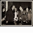 A. Philip Randolph and Vincent Impellitteri shaking hands next to (left ...