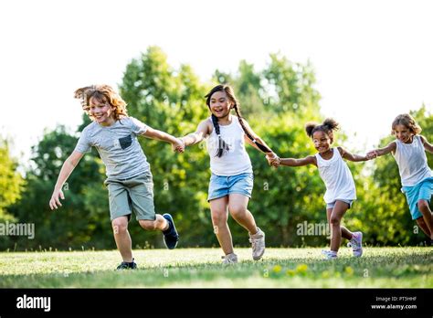 Children Running Holding Hands Hi Res Stock Photography And Images Alamy