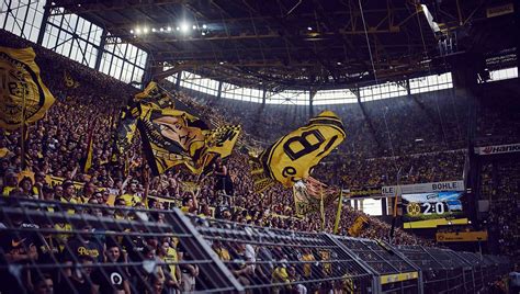 Borussia dortmund have been ordered to close the yellow wall for one match and a €100,000 fine has been demanded by the german football association (dfb) following major crowd trouble against rb leipzig. The Yellow Wall | Borussia Dortmund - SoccerBible