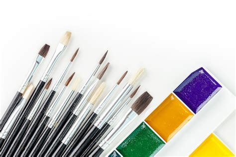 Premium Photo Set Of Watercolor Paints And Paintbrushes