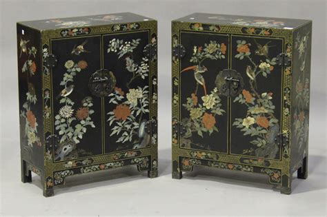 A Pair Of 20th Century Black Lacquered Chinoiserie Side Cabinets Each