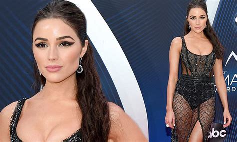 Olivia Culpo Flashes The Flesh In Sheer Bodysuit Dress As She Joins The