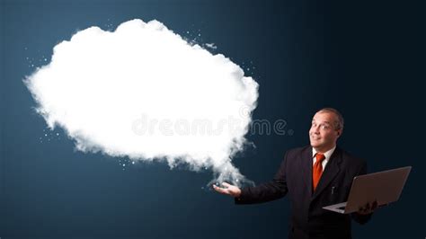 Businessman Holding A Laptop And Presenting Abstract Cloud Copy Stock