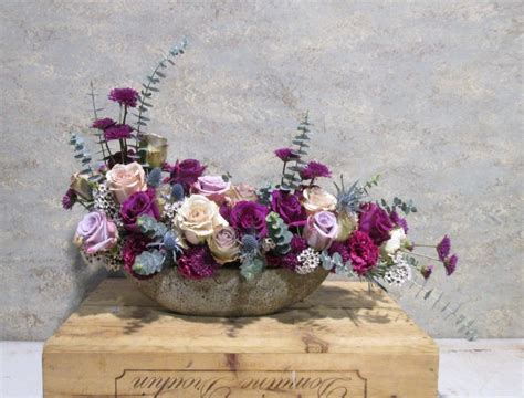 Modern Arrangement Of Purple And Tan Roses And Other