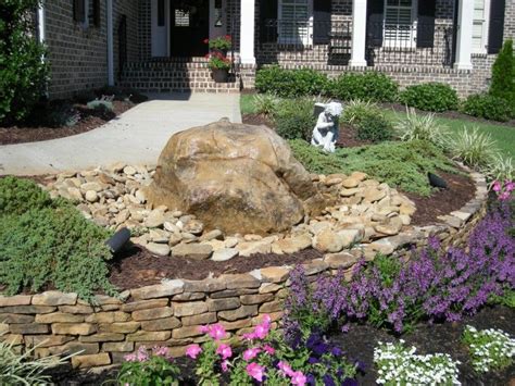 This Small Retaining Wall And Rock Water Feature Adds Character To This