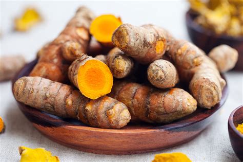 Fresh Turmeric Root Benefits Fresh Turmeric Roots With A Grater