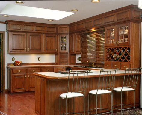 Traditional Style Kitchen With Detailed Raised Paneled Doors And Above