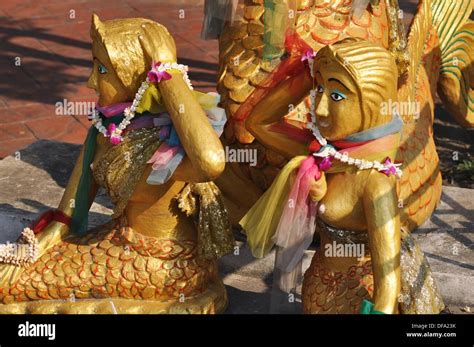 Bangkok Thailand Golden Mermaids Statues At The Bottom Of A Buddhist