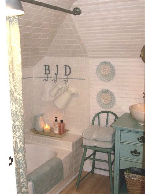 The dividing wall between the toilet and basins need not be ceiling height either and can be in the same glass bricks as the shower enclosure (illustrated. Tiny cottage attic bathroom-- love the chair, table vanity ...