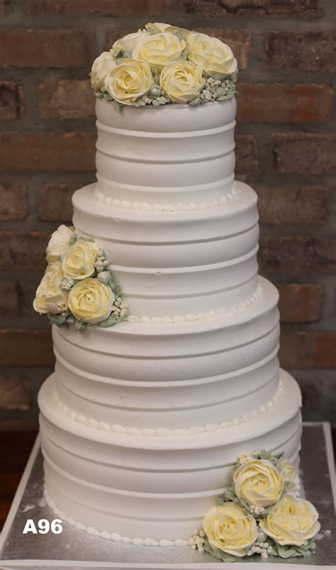 Simple with white flowers simple and chic buttercream wedding cakes . A96 - Yellow Rose White Buttercream Cake