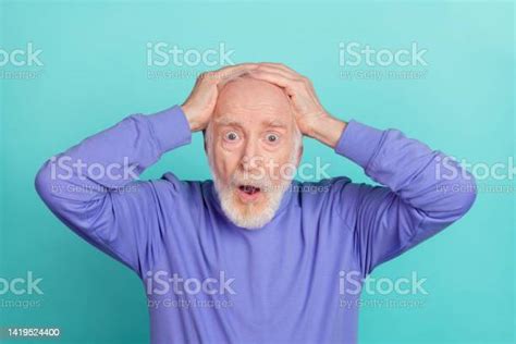 Portrait Of Speechless Confused Aged Man Open Mouth Arms Touch Head