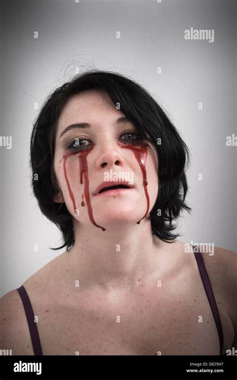 Woman With Blood Dripping From Under Her Eyes Stock Photo Alamy