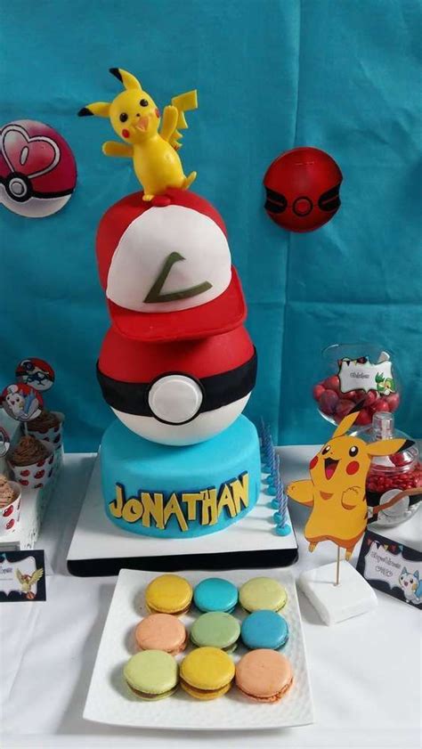 What A Great Poké Ball Cake With Ash Ketchums Hat And Topped With A