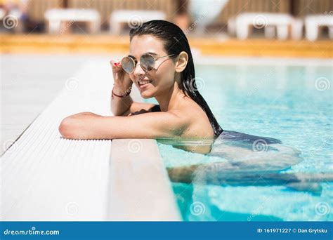 Young Woman In Sunglasses Relaxing At A Pool Stock Image Image Of Beauty Dream 161971227
