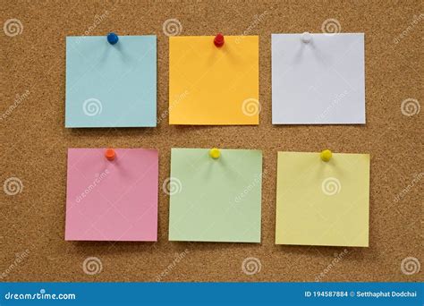 Colorful Reminder Sticky Notes Push Pins On Cork Board Stock Photo