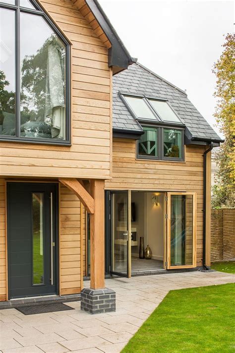 Contemporary Home Exterior With Cedar Timber Cladding And Grey Windows