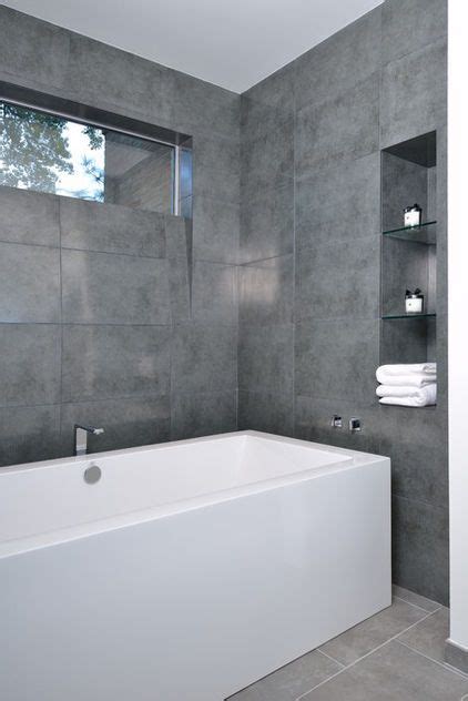 Top 60 best grey bathroom tile ideas neutral interior designs. Keep it clean and simple with large-format gray tiles and ...