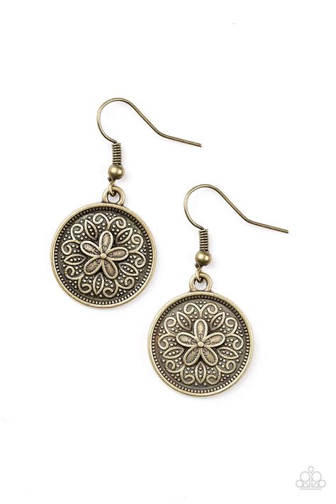 Embossed In A Leafy Floral Pattern A Dainty Brass Frame Swings From