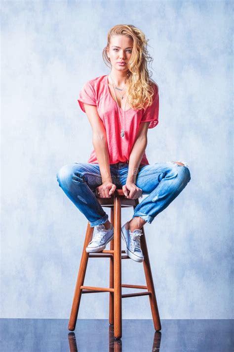 Blonde Girl Posing On A Chair With Legs Wide Open Stock Image Image