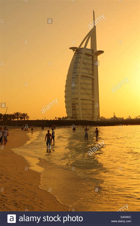 Jumeirah Beach And Burj Al Arab Hotel At Sunset Dubai United Arab