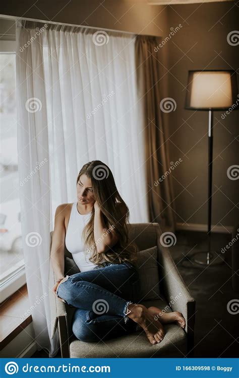 Beautiful Young Woman Sitting By The Window Stock Photo Image Of