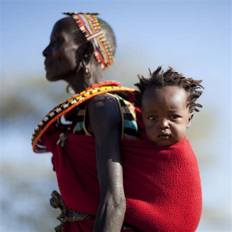 Samburu mother carrying her baby on her back - Kenya | Flickr