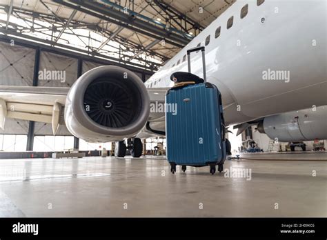 Suitcase Of Air Stewardesses In Empty Airport Hangar Stock Photo Alamy