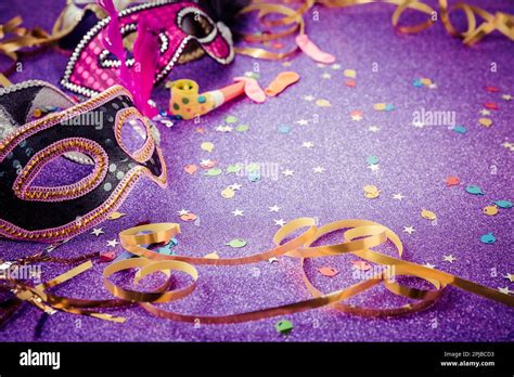 Carnival Mask Streamers And Confetti For Festive Background In Violet
