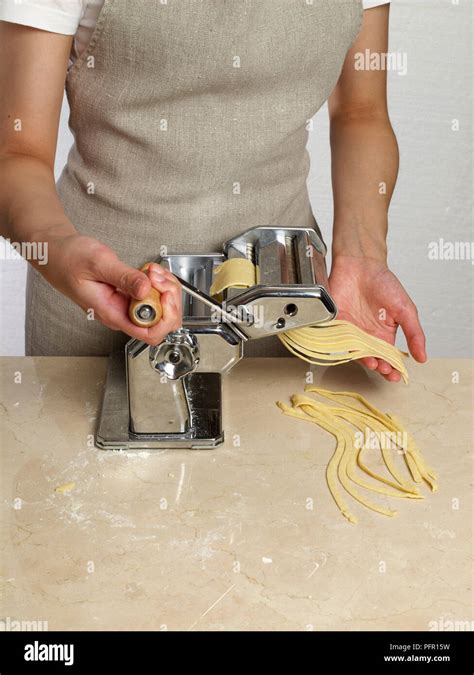 Making Gluten Free Ribbon Pasta Using A Pasta Machine Stock Photo Alamy