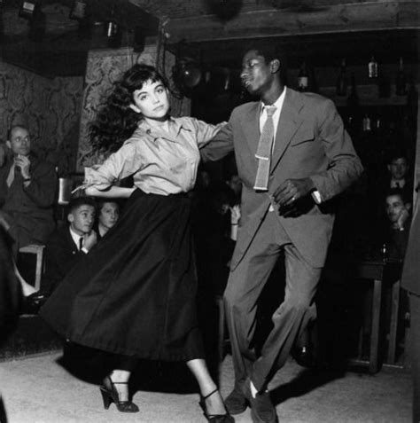 A Couple Dancing In A 1950′s “be Bop” Theater As Everyone Looks On