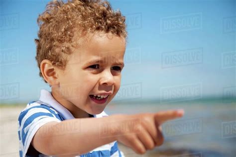 Adorable Little Kid Pointing At Something Interesting Outdoors Stock
