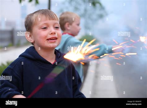 Two Young Boys With 4th Of July Sparklers Stock Photo Alamy