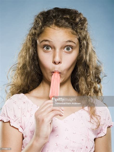 Girl Eating Popsicle High Res Stock Photo Getty Images