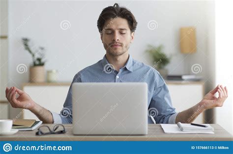 Relaxed Man Meditating Sitting At Laptop In Office Stock Image Image