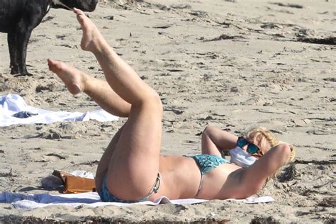 Britney Spears Sunbathing On The Beach In Malibu With Her Security
