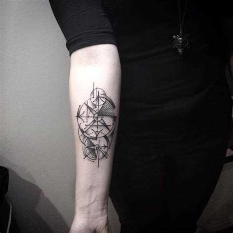 Abstract Compass Tattoo On The Forearm