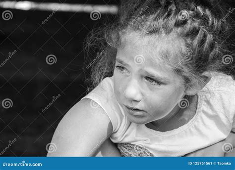 A Little Girl Is Crying A Tear Rolls Down Her Cheek Stock Image