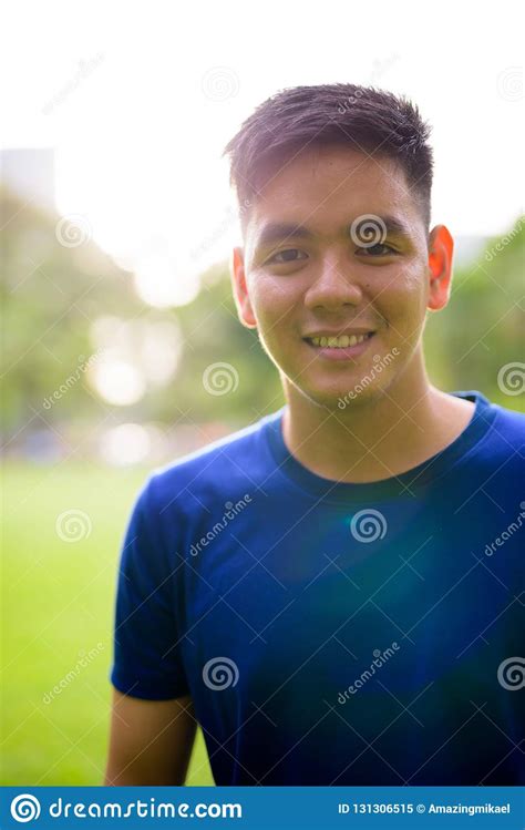 Young Handsome Asian Man Relaxing At The Park Stock Image Image Of