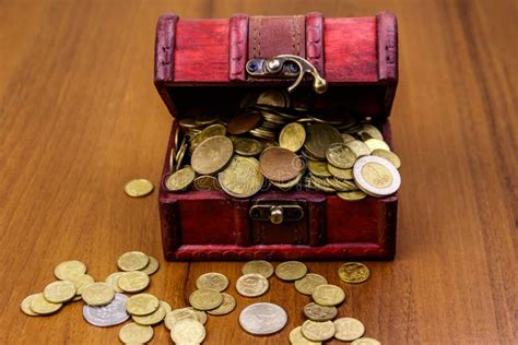Vintage Treasure Chest Full Of Golden Coins On Wooden Background Stock