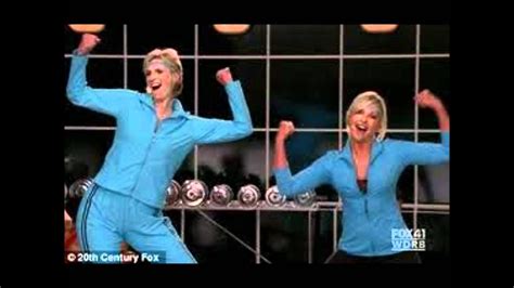 The australian singer gets all worked up in the latest episode of glee with the show's hilarious villain sue sylvester and the pair perform with a group of scantily clad muscle men. Glee: physical. - YouTube