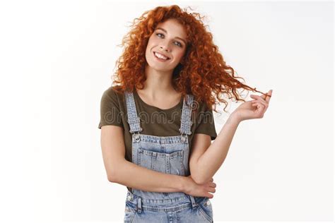 Carefree Charming Redhead Curly Haired Woman Standing Casually In