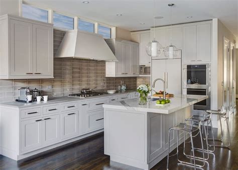 Grey shaker island with steel grey leathered granite worktop and barstools. Raised Panel Cabinetry | shaker island kitchen farmhouse ...