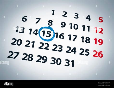 A Date Circled On A 15th Day Of A Calendar With Blue Ink Stock Photo