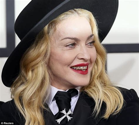 Lets be honest here, madonna doesn't have outstanding teeth, however considering the circumstances i would say they are very nice, despite her aging gap. Madonna and son David Banda, 8, hit Grammys 2014 red ...