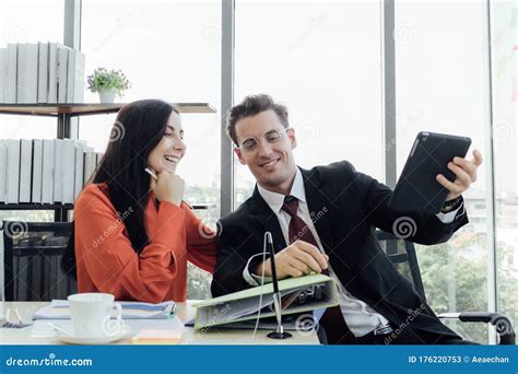Two Business People Discussing About Work In An Office Stock Image Image Of Consulting Chat